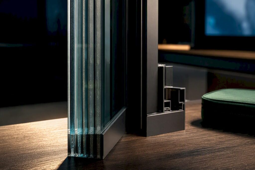Specifier examining laminated ballistic glazing edge