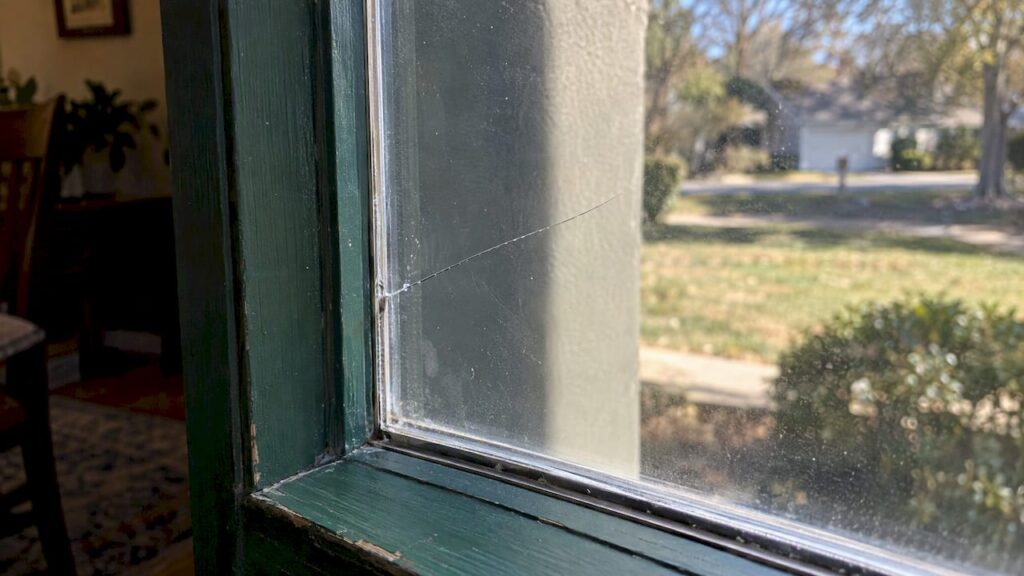 Edge-originating crack in a sunlit windowpane